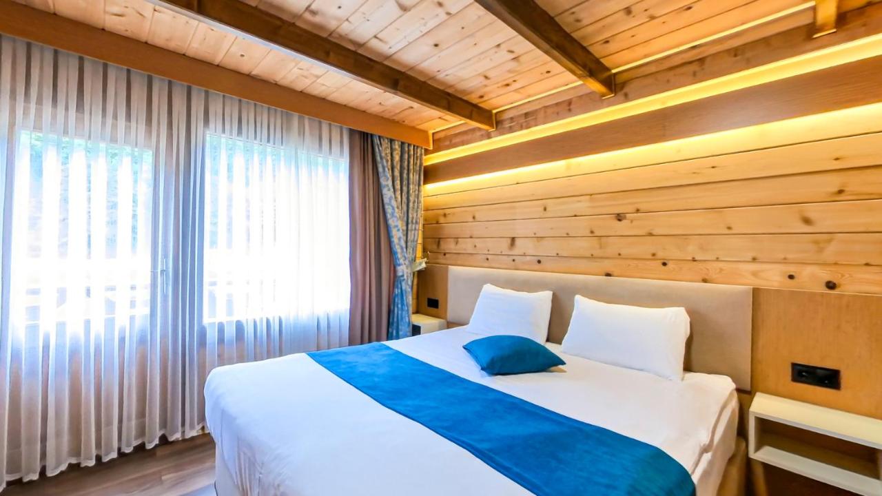 Deluxe üç kişilik oda, çift ve tek kişilik yatak